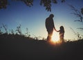 Father with little daughter walk at sunset Royalty Free Stock Photo