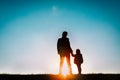 Father with little daughter walk at sunset Royalty Free Stock Photo