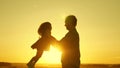 Father and little daughter whirl in dance at sunset. concept of happy childhood. Dad is dancing with child in her arms Royalty Free Stock Photo