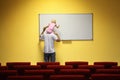 Father and little girl in empty presentation hall Royalty Free Stock Photo