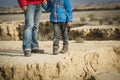 Father and little son hiking boots in mountains Royalty Free Stock Photo