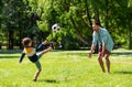 Father with little son playing soccer at park Royalty Free Stock Photo