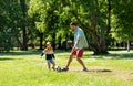 Father with little son playing soccer at park Royalty Free Stock Photo