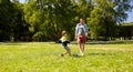 Father with little son playing soccer at park Royalty Free Stock Photo