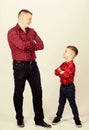 Father little son red shirts family look outfit. Best friends forever. Happiness being father of boy. Dad and adorable Royalty Free Stock Photo