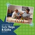 Father looking at baby playing with toy block at home and december is safe toys and gifts month text Royalty Free Stock Photo