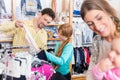 Father looking clothes for her daughter in shop Royalty Free Stock Photo