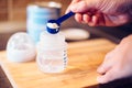 Father making baby formula in milk bottle Royalty Free Stock Photo