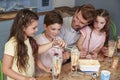 Father Making Ice Cream Sundaes With Children At Home