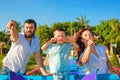 Father, mother, baby son on sea beach pointing ahead Royalty Free Stock Photo