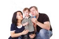 Father, mother and child blow bubbles
