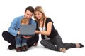 Father, mother and child look on laptop
