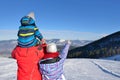 Father, mother and children are having fun and playing on snowy winter walk in nature. Royalty Free Stock Photo