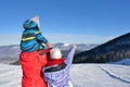 Father, mother and children are having fun and playing on snowy winter walk in nature. Royalty Free Stock Photo