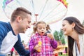 Father, mother, daughter blowing bubbles, amusement park, fun fa Royalty Free Stock Photo