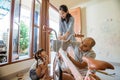 Father, mother and daughter installing basket on new mini bike