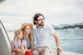 Father, mother and daughter sailing on yacht at the sea Royalty Free Stock Photo
