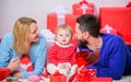 Father, mother and doughter child. Keeping love in their hearts. Valentines day. Red boxes. Happy family with present