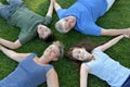 Family, father, mother, son and daughter lying in the meadow Royalty Free Stock Photo