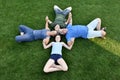 Family, father, mother, son and daughter lying in the meadow Royalty Free Stock Photo