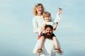 Father mother and his son playing outdoors. Summer ration. Cute little boy is holding paper airplane. Happy family Royalty Free Stock Photo