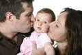 Father and mother kissing baby Royalty Free Stock Photo