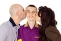 Father and mother kissing son cheek