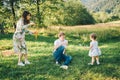 Father and mother play with his daughter with soapbubble Royalty Free Stock Photo