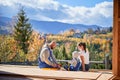 Father, mother and son building wooden frame house. Royalty Free Stock Photo