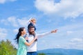 Father mother and son in the park. Freedom to Dream - Joyful Boy Playing With Paper Airplane. Royalty Free Stock Photo