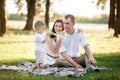 Father, mother and son in the park together on a sunny summer day. happy young family having fun outdoor Royalty Free Stock Photo