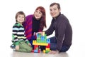 Father, mother and son playing lego Royalty Free Stock Photo