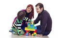 Father, mother and son playing lego Royalty Free Stock Photo