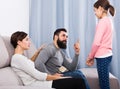 Father and mother telling off daughter Royalty Free Stock Photo