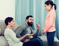 Father and mother telling off daughter Royalty Free Stock Photo