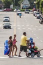 Father and Mother with their Son crossing the Road Royalty Free Stock Photo