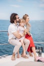 Father, mother and daughter sailing on yacht at the sea Royalty Free Stock Photo