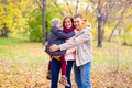 Father and Mother With Young Son On hands Autumn Park Royalty Free Stock Photo