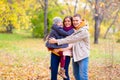 Father and Mother With Young Son On hands Autumn Park Royalty Free Stock Photo