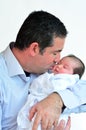 Father and newborn baby kissing and hugging. Royalty Free Stock Photo