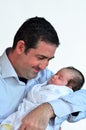 Father and newborn baby kissing and hugging. Royalty Free Stock Photo