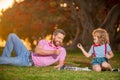 Father play chess with son. Family outside game. Intelligent child, smart kids.