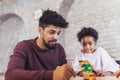 Father play educational games with his daughter