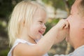 Father Playing With Cute Baby Girl Outside at the Park Royalty Free Stock Photo