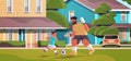 father playing football with son on backyard lawn parenting fatherhood concept dad spending time with kid Royalty Free Stock Photo