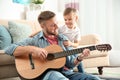Father playing guitar for his son Royalty Free Stock Photo