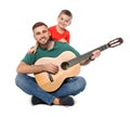 Father playing guitar for his son Royalty Free Stock Photo