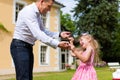 Father is playing with his daughter on a meadow Royalty Free Stock Photo