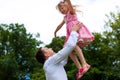 Father is playing with his daughter on a meadow Royalty Free Stock Photo