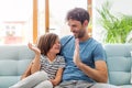 Father playing with his son on sofa Royalty Free Stock Photo